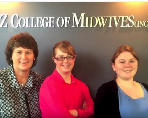 Biddy and colleagues in front of the New Zealand College of Midwives Sign.