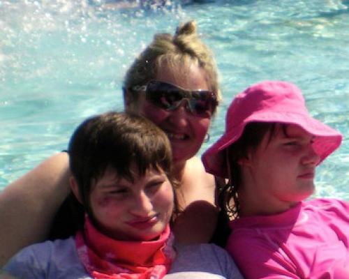 An image of Shannen and Keriann Andrell with their carer Renee enjoying the hot pools at Hanmer.