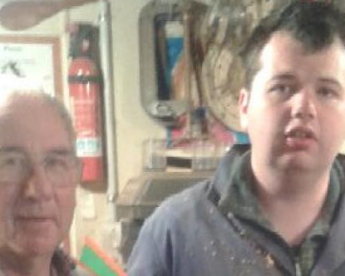 An image of Tarwyn Nicholson and Noel Graham showing his workmanship with the wooden bowl he carved. 